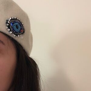 Elegant White Wool Beret with Beaded Eye Design